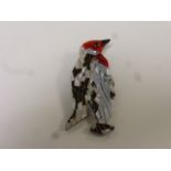 Lea Stein style celluloid brooch modelled as a Penguin, black and silvered body with red head and