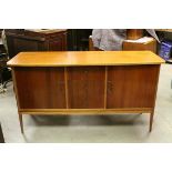 Mid 20th century Peter Hayward for Vanson Sideboard comprising a central bank of three drawers (