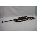 A Feinwerkbau Sport 127 Cal. .22 Air Rifle With Model 12 Wide Angle 4 x 10 Scope.