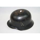 A Well Made Replica World War Two German Helmet Complete With Liner.