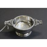 White metal footed quaich with Celtic knot design handles and decoration to interior,