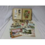 Assorted humorous postcards, holiday postcards and Victorian photograph album