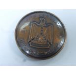 Cased bronzed medallion with Arabic writing, inscribed name A.W. Baker, diameter approximately 7cm