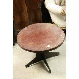 Early 20th century Bakelite Circular Coffee Table raised on an interlocking base, 60cms diameter x