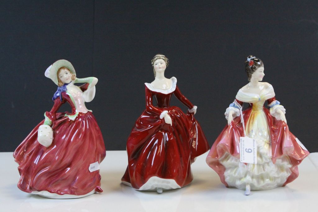 Three Royal Doulton figurines to include; Autumn Breezes HN1934, Fragrance HN3311 a Michael