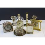Four vintage Clocks to include Anniversary type and two pairs of Candlesticks to include Brass