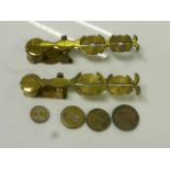 Two pairs of Victorian brass sovereign scales together with weights