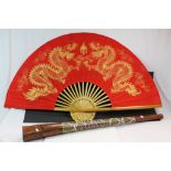 Wooden Didgeridoo with painted decoration and a large Oriental Fan