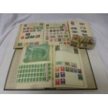 Two stamp albums containing world stamps together with a quantity of Green Shield stamp sheets and