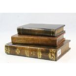 Stand in the form of a Stack of Three Antique Leather Books