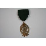 A Royal Navy Reserve Officers Decoration Medal, An Oval Silver Gilt Medal Formed By The Royal Cypher