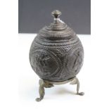 Ornately carved 19th Century Coconut Tea caddy & lid with Brass tripod feet and lid finial