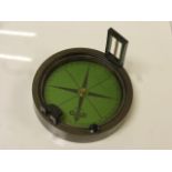 Prismatic compass with green dial, diameter approximately 10cm, boxed