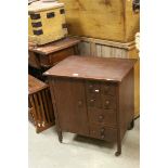 Mid 20th century Stained Wooden Sewing Table with Cupboard either side flanked by Seven Drawers