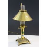 Contemporary Brass electric table lamp designed as a an Oil lamp on paw feet with "Paris Orient