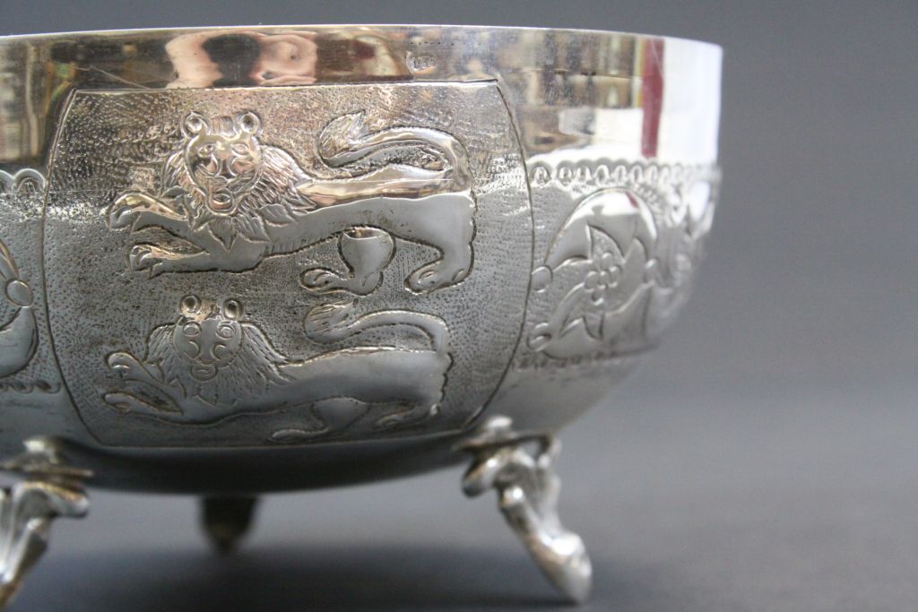 White metal bowl raised on three feet, repousse lion and stylised floral decoration, approximately - Image 5 of 5