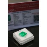 Loose octagon cut emerald, accompanying certificate stating weight 7.37 carats, dimensions 11.56 x