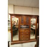 Large Late Victorian Mahogany Compendium Wardrobe comprising of a Central Bank of Two Carved Doors