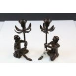 Pair of Patinated metal Candlesticks modelled as Monkeys