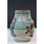 Antique Oriental Ceramic Vase with raised figures and script panels, has four character seal marks