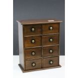 Vintage Teak Spice Cabinet comprising Eight Drawers with Brass Recessed Knob Handles, the drawers