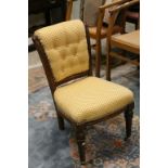 19th century Nursing Chair with Upholstered Scroll Back and Seat raised on turned front legs and