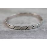 Hans Hansen Danish silver bangle, of scrolled ribbon design, width approximately 6mm, signed Hans