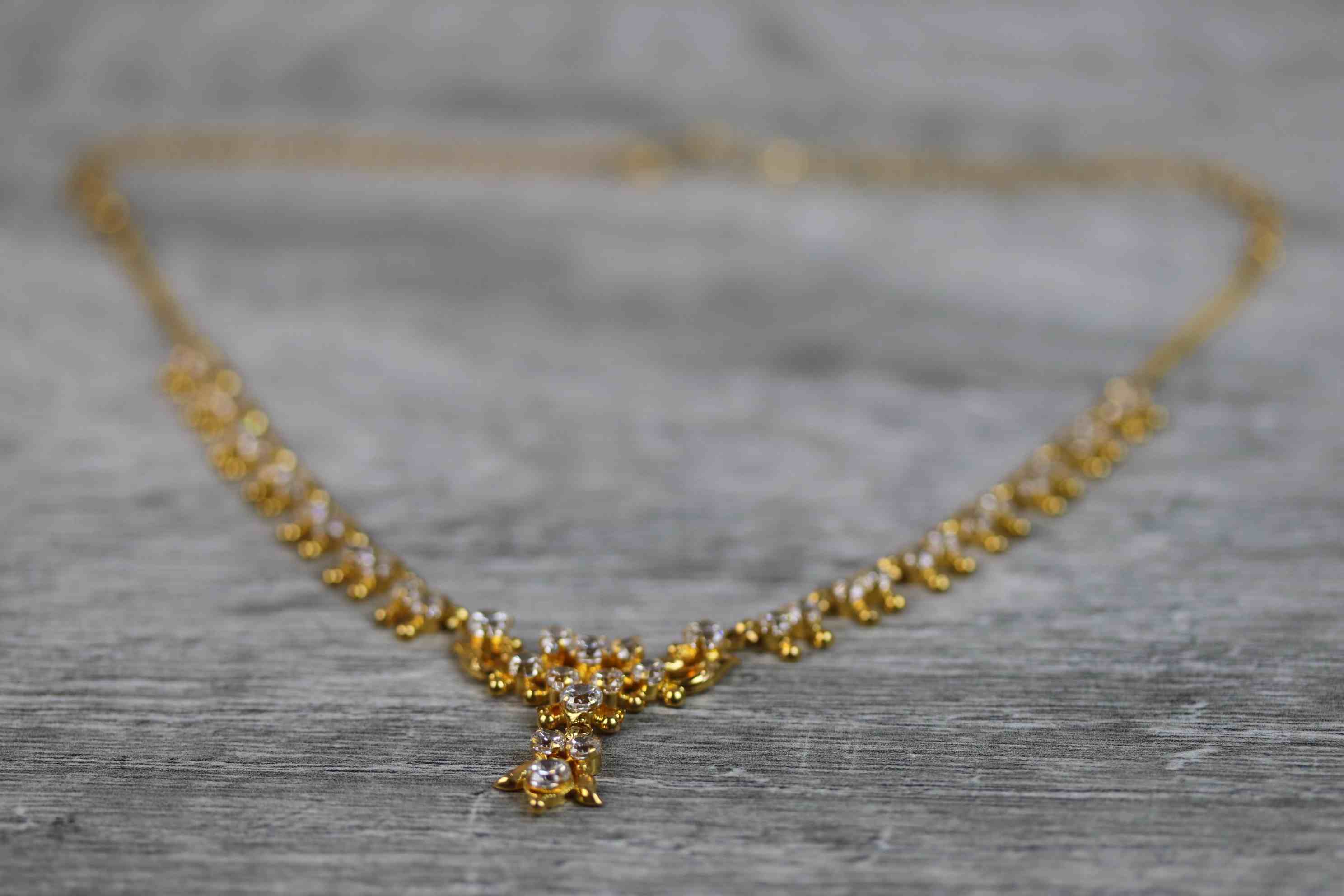 Indian yellow metal CZ fringe necklace, the central motif with suspended CZ cluster pendant drop, - Image 3 of 9