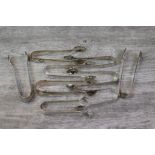 Eight pairs of silver sugar tongs to include a pair of Victorian Mappin & Webb silver sugar tongs