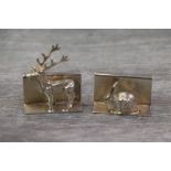 Two silver miniature ornaments realistically modelled as a stag and a bunny rabbit, heights