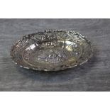 Victorian silver oval trinket dish, repousse fruit decoration to centre with smaller fruit design