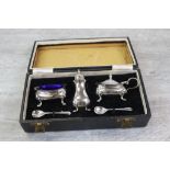 George VI cased three piece silver cruet set, comprising pepper pot, open salt cellar and mustard