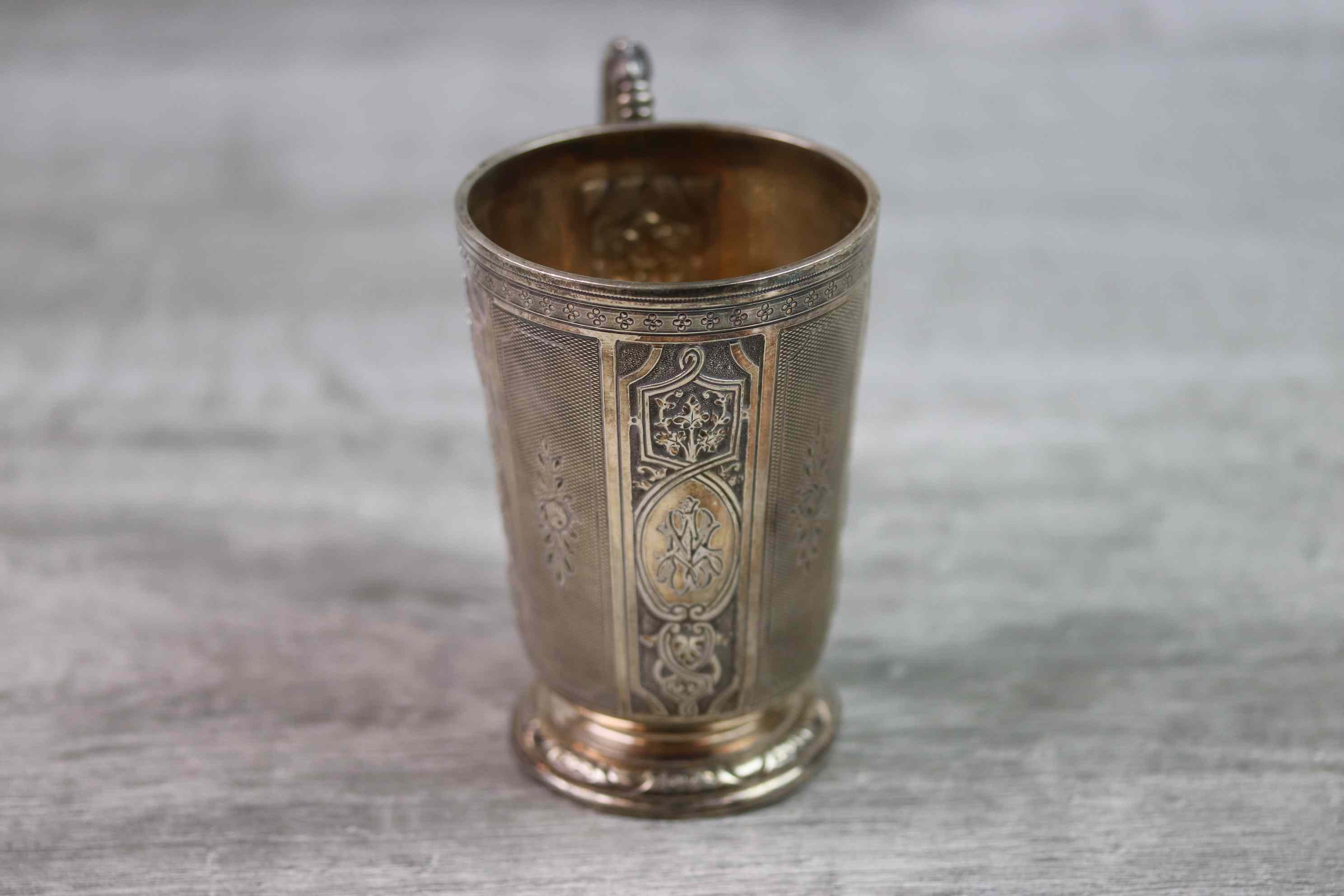 Victorian silver footed mug with sectional repousse scroll and stylised foliate decoration to - Image 4 of 13