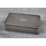 Silver cigarette box, with scalloped lozenge engine turned decoration to lid, base and sides,