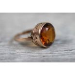 Citrine solitaire 9ct yellow gold dress ring, the round mixed cut orange citrine diameter