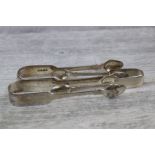Three pairs of silver fiddle pattern sugar tongs, makers William Johnson, London 1831; Robert