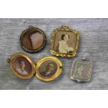 Collection of Victorian pendants to include yellow metal pendant, the central glazed panel