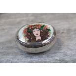 Imported late 19th century Arts & Crafts enamelled silver snuff box of oval form, the hinged lid