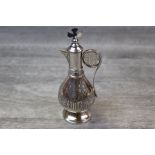Edwardian silver Communion flagon of baluster form, engraved ivy leaf and patonce cross decoration