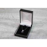 Sapphire and diamond 18ct white gold pendant necklace, the blue oval mixed cut sapphire measuring