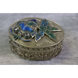 Enamelled white metal oval lidded trinket box, the lid depicting an enamelled fish in relief, the