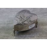 Edwardian silver heart shaped jewellery box raised on three feet with foliate shoulders, the