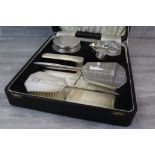 Ladies silver dressing table set comprising silver backed brush, hand mirror and clothes brush, a