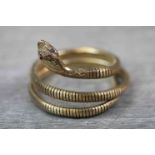 Victorian style 9ct yellow gold coiled serpent bracelet, the engraved head set with small round