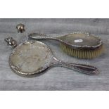 Early George V silver back dressing table brush and matching hand mirror, stylised floral pattern