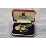 Boxed Pobjoy Mint 22ct Gold proof 1/10 Angel coin 1985 with COA plus another 1990 dated example on a