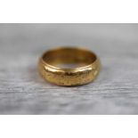 22ct yellow gold wedding band, partially rubbed engraved ivy leaf decoration, band width