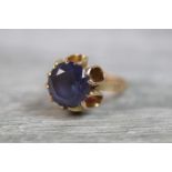 Synthetic colour change sapphire solitaire 18ct yellow gold ring, the round mixed cut stone diameter