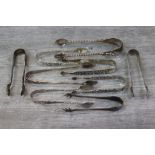 Nine Victorian and later silver sugar tongs, various, to include apostle sugar tongs, pierced