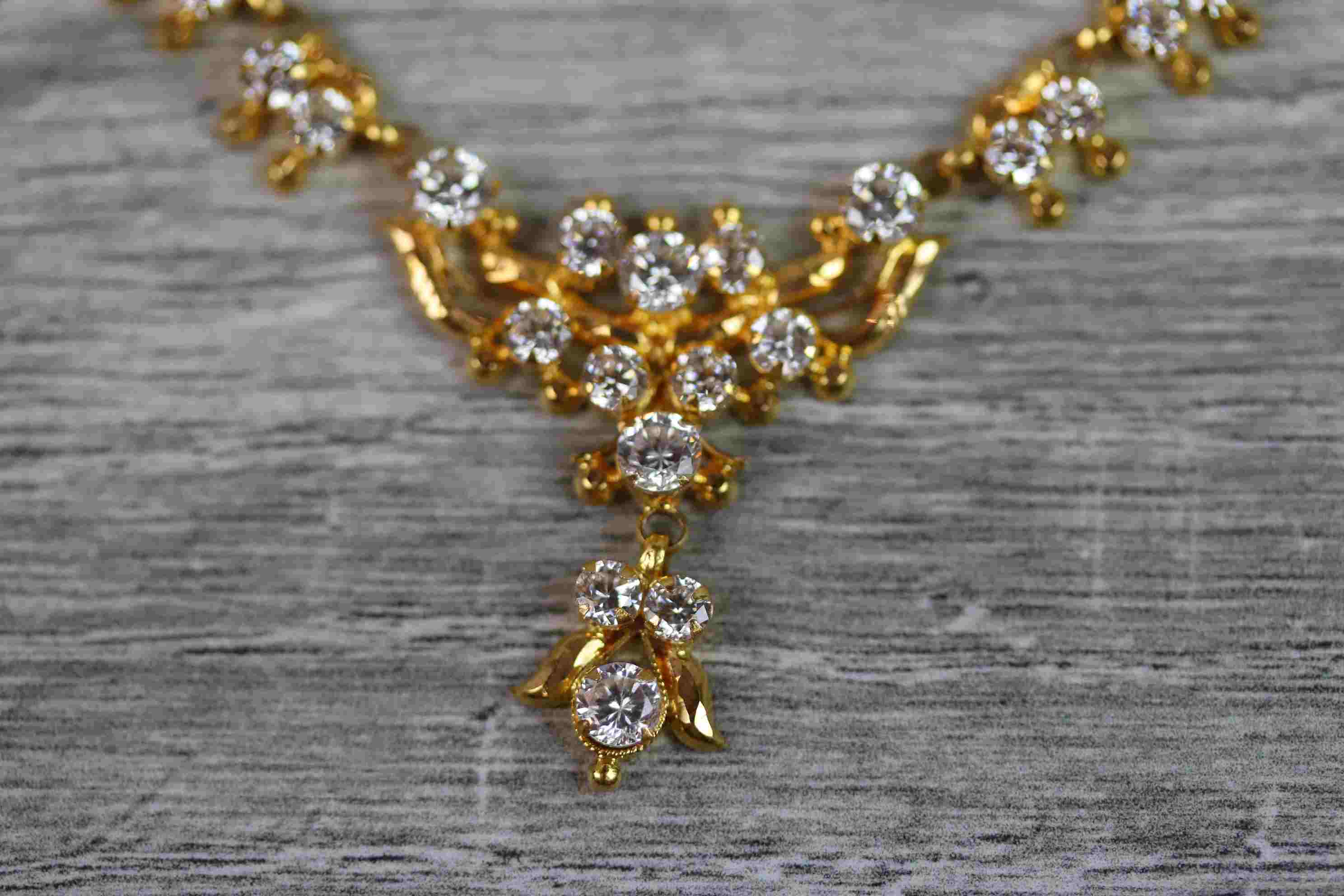 Indian yellow metal CZ fringe necklace, the central motif with suspended CZ cluster pendant drop, - Image 2 of 9